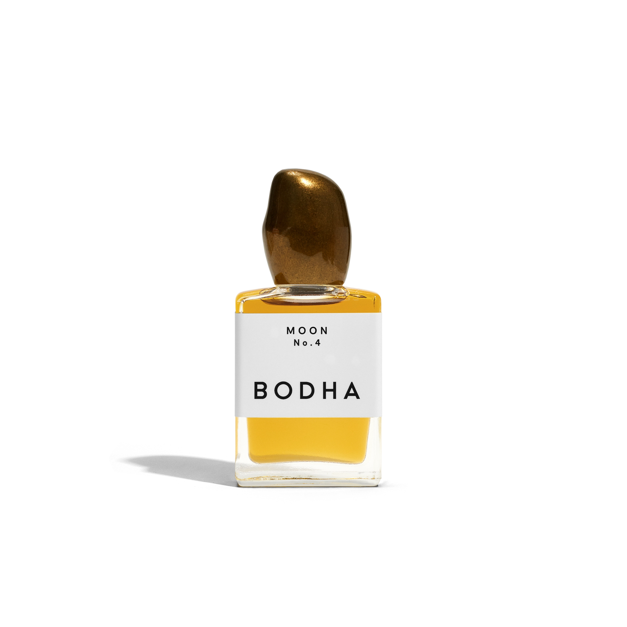 Bodha perfume bottle with gold cap and yellow liquid on white background