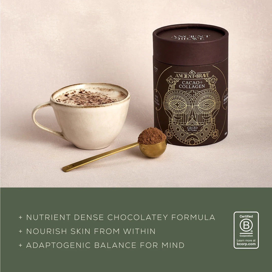 Cup of Ancient + Brave Cacao + Collagen hot chocolate beside the tub, a nutrient-dense chocolatey formula with adaptogens