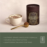 Cup of Ancient + Brave Cacao + Collagen hot chocolate beside the tub, a nutrient-dense chocolatey formula with adaptogens