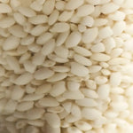 Rice grains representing the dual rice ferments in DAMDAM Ume Plum Firming Serum