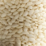 Rice grains representing the dual rice ferments in DAMDAM Ume Plum Firming Serum