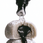 Herbar The Lip Butter Black Sesame tube with black sesame mochi, the dessert that inspired its flavour