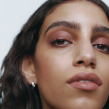 Model wearing Manasi 7 All Over Colour Rojizo on cheeks, lips and eyelids for a natural dusty rose look