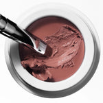 Brush picking up Manasi 7 All Over Colour Rojizo to show its creamy, buildable texture