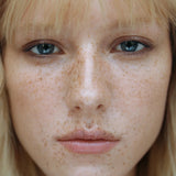 Model wearing Manasi 7 Eye and Lip Definer Nocturne as soft bronze definition along the lash line