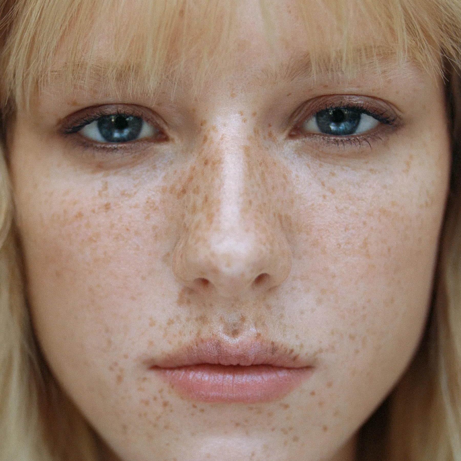 Model wearing Manasi 7 Eye and Lip Definer Nocturne as soft bronze definition along the lash line