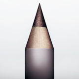Sharpened tip of Manasi 7 Eye and Lip Definer Nocturne against a soft dark background