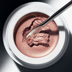 Spatula scooping Manasi 7 Eye Glow Colour Ayame to show its creamy, blendable texture
