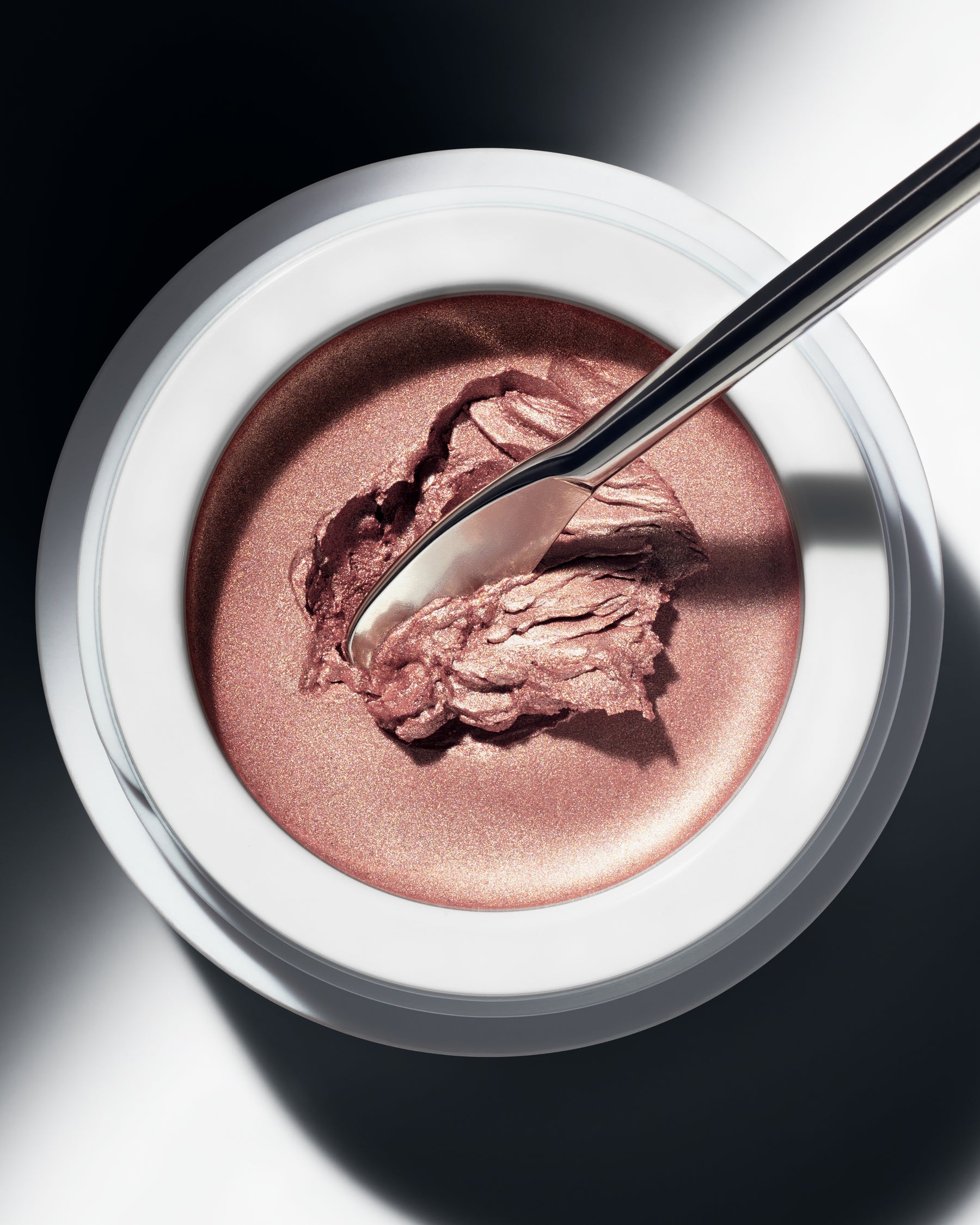 Spatula scooping Manasi 7 Eye Glow Colour Ayame to show its creamy, blendable texture