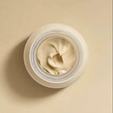 Open jar of RAESO Cocoon Ceramide Cream mini showing its whipped, cushiony texture