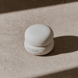 RAESO Lunar Veil Chrono-Active Sleep Mask 5 ml mini jar in soft sunlight