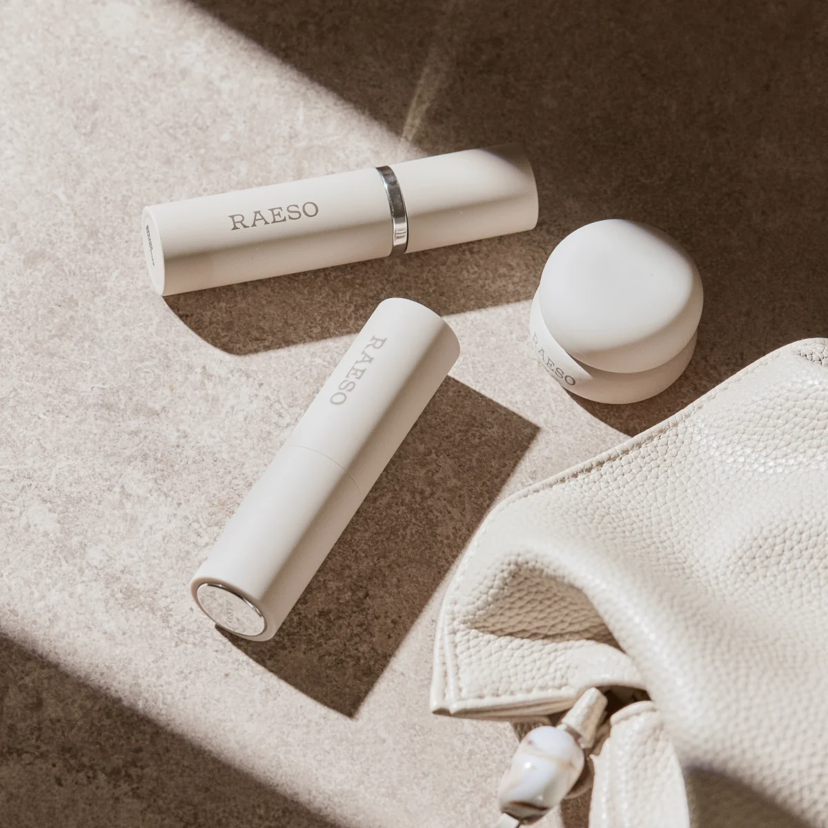 RAESO Tranquillity Water Activating Mist spraying beside the cleanser and sleep mask minis from the Three-Step Overnight Facial Set
