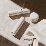 RAESO Tranquillity Water Activating Mist spraying beside the cleanser and sleep mask minis from the Three-Step Overnight Facial Set