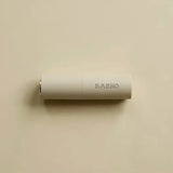 RAESO Tranquillity Water Activating Mist mini lying on a soft beige background