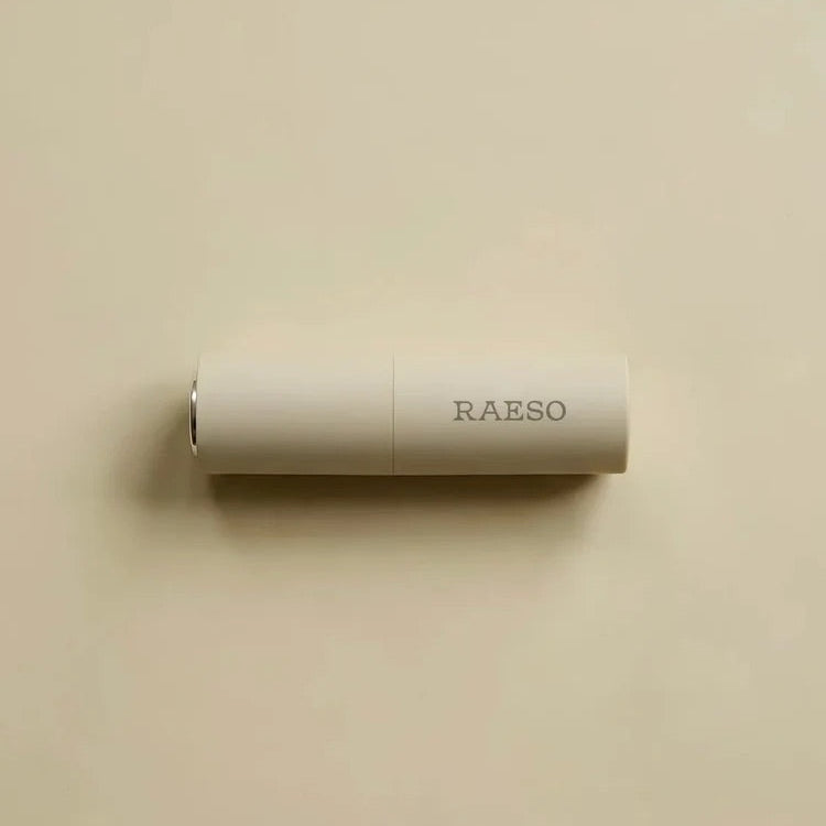 RAESO Tranquillity Water Activating Mist mini lying on a soft beige background