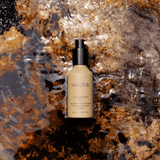 Sándor The Grounding Oil 76 ml hair oil resting on wet natural rock